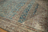 Distressed Malayer rug, showing abrash, Herati motif, and meandering vine border.