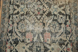 Distressed Mahal runner detail: worn charcoal Herati motif, exposed ivory foundation, blush accents.