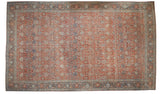 Vintage distressed Bijar carpet with a classic floral palmette design in soft ruby red, powder blue, and ivory.