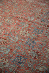 A soft, low pile on a distressed vintage Bijar carpet with visible knot heads and floral motifs.