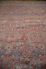 Close perspective on the even wear and floral pattern of a vintage Bijar carpet.