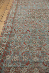 Distressed vintage Hamadan runner displaying Herati pattern, classic border, pale blue, and time-softened tones.