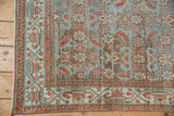 Distressed vintage Hamadan runner corner, pale powder blue Herati field, and rust-toned serbend borders.