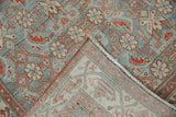 Vintage distressed Hamadan runner showing dusty blue, ivory Herati pile and folded hand-knotted back.