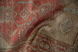 Close-up of distressed vintage Northwest Persian rug runner's textured red and beige pile, with faint foundation.