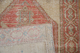 Distressed pile of Northwest Persian runner, with visible knot heads and hand-knotted reverse.