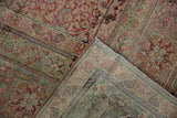 A folded corner reveals the fine hand-knotted construction of an antique Kermanshah carpet.