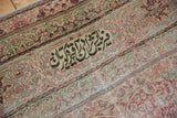 Inscribed weaver's signature cartouche on the main border of an antique Kermanshah carpet.