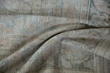 Visible foundation and worn knot heads on distressed Doroksh carpet in ivory, teal.