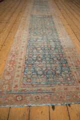 Textured pile of distressed vintage Malayer runner, pale sapphire blue, terra cotta Herati, floral border.