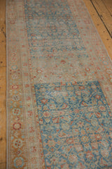 Distressed Malayer runner featuring worn pale sapphire blue Herati field and floral border.