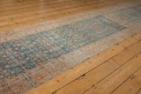 Distressed Malayer runner with pale sapphire blue Herati field and terra cotta floral border.