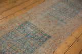 Distressed Malayer runner with pale sapphire blue Herati, terra cotta border, and visible foundation.