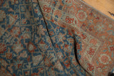 Textural close-up: distressed Malayer runner, Herati motif in pale sapphire, terra cotta.
