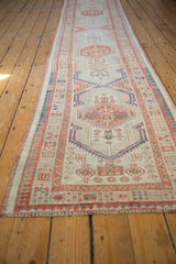 Texture and geometric design of a vintage distressed Serab runner in ivory, terra cotta, and faded blue.