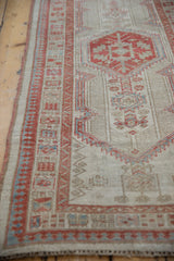 Distressed Serab runner with geometric patterns, storied abrashes, and muted terra cotta and ivory tones.