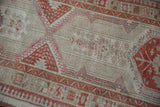 Distressed Serab runner detail: low pile, visible knot heads, geometric ivory and terra cotta patterns.