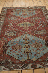 Distressed dusty denim blue medallion detail of vintage Hamadan rug, geometric floral motifs.