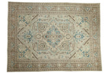 Distressed Turkish Sparta carpet with geometric medallion, palmette finials, ivory, and pale denim blue.
