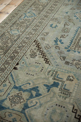 Distressed vintage Sparta carpet, geometric ivory and pale denim blue motifs, faint foundation.