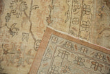 Visible foundation, knot heads, and intact side cord selvage of the distressed Sparta carpet.