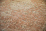 Distressed texture reveals serrated leaves and floral vinery in sandalwood and silver tones.