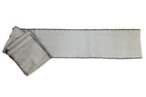 Vintage Turkish flatweave runner with a speckled ivory field and dark charcoal side cord edging.