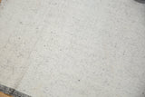 Subtle speckled character on the hand-spun ivory and charcoal Turkish flatweave.