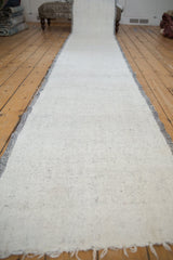 The entire length of a vintage Turkish flatweave runner in speckled ivory and charcoal.