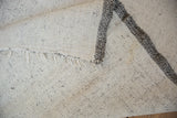 The reverse side of a Turkish flatweave showing the hand-woven construction and secured fringe.
