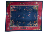 Vintage Nichols Art Deco rug, navy field, cochineal red border, pictorial trees, lotus flowers.
