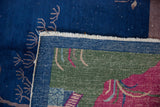 Hand-knotted foundation and fringe detail of a Chinese Art Deco rug in blue, green, and magenta.