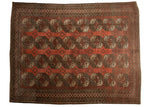 Vintage Ersari carpet with repeating geometric guls in distressed dusty red and brown.