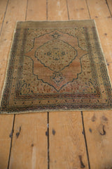 Vintage Tabriz rug corner detailing book cover spandrel, faint foundation, and muted tones.