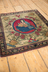 Angled perspective of the antique Isfahan rug highlighting its pictorial center medallion.