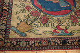 Potted rose floral design and detailed navy border of a short-pile antique Persian Isfahan rug.