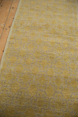 Distressed saffron gold and beige geometric panel motif on a vintage Khotan rug runner.