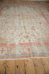 Vintage Oushak carpet with ivory field, terra cotta and powder blue floral vinery.