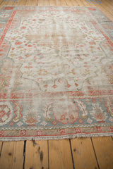 Vintage Oushak carpet's secured fringe and patterned end border in powder blue and terra cotta.