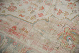 Vintage Oushak rug pile with even wear, softened floral motifs, terra cotta, ivory, powder blue.