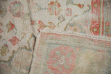 1920s vintage Oushak rug detail: knot head wear, floral motifs, and hand-knotted reverse.