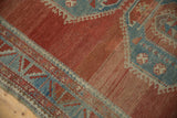 Powder blue serrated leaf border of a distressed Caucasian rug, showing cinnabar abrash and even wear.
