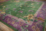 Detail of the Chinese Art Deco carpet with intricate floral vines across emerald green and purple.