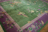 Emerald green Art Deco carpet corner with purple border and pictorial floral motifs.