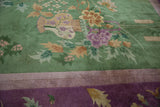 Vintage Chinese Art Deco carpet: emerald green field, vased plants, lotus flowers, mauve border.