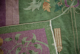 Hand-knotted foundation in green and purple, intact selvage, and visible white knot heads.