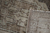 Distressed vintage Hamadan rug pile with visible foundation and muted blue-silver tones.