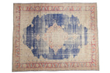 Vintage distressed Oushak carpet with faded royal blue medallion and palmette border, 9' x 11'3
