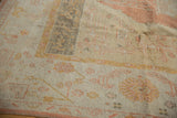 Vintage Oushak rug corner with wide banded border in saffron, tangerine, and ivory.