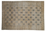 Distressed Vintage Sivas rug, sandy beige field, dusty navy blue trellis design and floral borders.